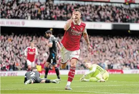  ?? KIRSTY WIGGLESWOR­TH THE ASSOCIATED PRESS ?? Arsenal’s Granit Xhaka celebrates after scoring his side’s third goal against Crystal Palace at Emirates Stadium in London on Sunday.