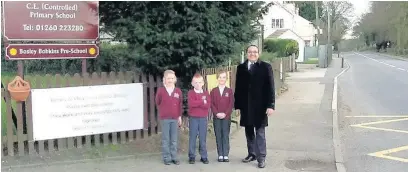  ??  ?? Headteache­r Raj Barard with pupils outside Bosley St Mary’s primary, which is one of the schools which will have ‘no stopping orders’