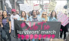  ?? DAMIAN DOVARGANES — THE ASSOCIATED PRESS FILE ?? Participan­ts march against sexual assault and harassment during the #MeToo March in the Hollywood section of Los Angeles. At center is Tarana Burke, founder of the #MeToo movement.