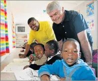  ?? Picture: FREDLIN ADRIAAN ?? CLEVER SPACE: After officially opening the new container classroom at Sinethemba creche are, back from left, Tommy Jacbus, Heinz Fishera with, front from left, Raphinas Rima, Isiphile Nqubane and Luyolo Siko