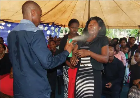  ?? PICTURE: FACEBOOK ?? PROPHET OF DOOM: Lethebo Rabalago of Mount Zion General Assembly in Limpopo sprays insecticid­e on a congregant.