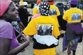  ?? Tsvangiray­i Mukwazhi ?? The Associated Press Supporters of Robert Mugabe wear T-shirts bearing his image at an election rally July 14 in Masvingo, Zimbabwe. Anger over Mugabe’s removal as president is being channeled into support for opponents of the party he long controlled.