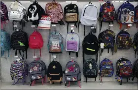  ?? GENE J. PUSKAR — THE ASSOCIATED PRESS FILE ?? A July 2018 photo shows a display of school backpacks in a Target store in Pittsburgh.