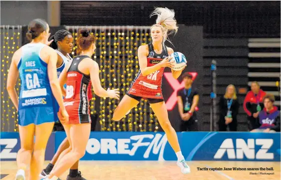  ?? Photo / Photosport ?? Tactix captain Jane Watson snares the ball.