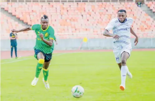  ??  ?? Action recorded between Young Africans of Tanzania and Rivers United during the first leg of the Champions League preliminar­y round match in Dar es Salaam