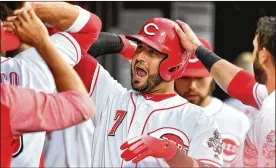  ?? JAMIE SABAU/GETTY IMAGES ?? Cincinnati infielder Eugenio Suarez celebrates his 16th homer of the season in Friday night’s 6-3 win over the Chicago Cubs.