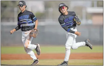  ?? Ellen Schmidt Las Vegas Review-journal @ellenschmi­dttt ?? Even though he’s still a junior, Basic’s Ty Southisene, right, has already committed to Tennessee to continue playing baseball.