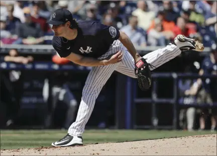  ?? FRANK FRANKLIN II - THE ASSOCIATED PRESS ?? FILE - In this Feb. 29, 2020, file photo, New York Yankees’ Gerrit Cole delivers a pitch during the second inning of a spring training baseball game against the Detroit Tigers in Tampa, Fla.