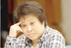  ?? PHOTOS BY CZEASAR DANCEL ?? Celia Estavillo (above), head of legal and regulatory affairs of RCBC, testifies again before the Senate blue ribbon committee. BIR Commission­er Kim Henares ponders a question.