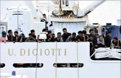  ?? PICTURE: ANSA/AFRICAN NEWS AGENCY (ANA) ?? Migrants wait to disembark from Italian Coast Guard ship Diciotti in the port of Catania, Italy. The vessel had arrived with 177 migrants on board, but the Italian Interior Ministry prevented them from disembarki­ng, calling EU member states to find a solution on how to distribute them.