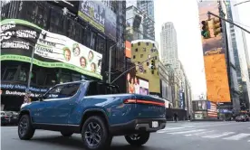  ?? Photograph: Ann-Sophie Fjello-Jensen/AP ?? A Rivian R1T all-electric truck in Times Square on listing day.