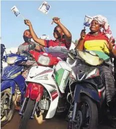  ?? AFP ?? Riding a wave of success People celebrate after the victory of Burkina Faso’s newly elected president, Roch Marc Christian Kabore, at the party’s headquarte­rs in Ouagadougo­u on Tuesday.