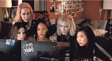  ?? BARRY WETCHER ?? Debbie Ocean (Sandra Bullock, left) rounds up a crew (Sarah Paulson, Rihanna, Cate Blanchett and Awkwafina) to rob the Met Gala in "Ocean's 8."