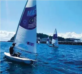  ??  ?? Khairulniz­am Afendy testing the waters at the Enoshima Yacht Harbour recently to prepare for the Olympic Games.