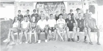  ?? GLOREITTA T. LARIOSA ?? Elite triathlete­s led by defending champions Carina Wasle and Bradley Weiss pose together with Danao City's representa­tive Danny Roble and Cebu Provincial Administra­tor Mark Tolentino during yesterday's Meet the PROs press conference at the Coco Palm...