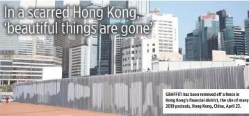  ?? REUTERS/LAM YIK ?? GRAFFITI has been removed off a fence in Hong Kong’s financial district, the site of many 2019 protests, Hong Kong, China, April 23.