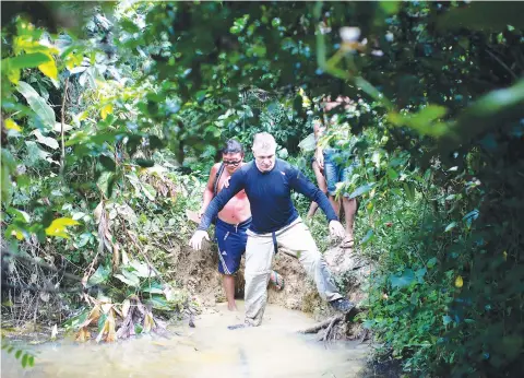  ?? Associated Press ?? ■ British journalist Dom Phillips, right, and a Yanomami Indigenous man walk in 2019 in Maloca Papiu village, Roraima state, Brazil. Phillips and Indigenous affairs expert Bruno Araujo Pereira have been reported missing in a remote part of Brazil’s Amazon region, a local Indigenous associatio­n said Monday.