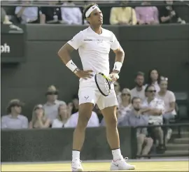  ?? TIM IRELAND – THE ASSOCIATED PRESS ?? Rafael Nadal reacts after losing a point against Gilles Muller in their fourth-round match on Monday. Nadal rallied from two sets down but fell in five sets