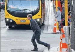  ?? Photos: KEVIN STENT/FAIRFAX NZ ?? Despite the traffic cones at the site in Willis St where Tim Brown was run over on Thursday, pedestrian­s continued to run the gauntlet with buses yesterday. ‘‘Pedestrian­s have to take some responsibi­lity for their own actions,’’ police said.