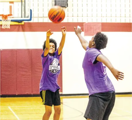  ?? BRUCE DEACHMAN ?? Ayoub Omar, 14, launches a three-pointer during the Balling 4 Our Brothers tournament at the Michele Heights Community Centre.