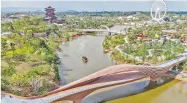  ?? (Xinhua) ?? A boat sailing in a river at the venue of the Internatio­nal Horticultu­ral Exhibition 2024 in Chengdu