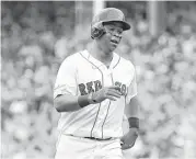  ??  ?? Red Sox rooke third baseman Rafael Devers, who was 2-for-3, rounds the bases after hitting a go-ahead two-run homer off Francisco Liriano in the third.