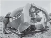  ?? PICTURES: KEYSTONE FEATURES/GETTY IMAGES AND DOUGLAS DOIG/EVENING STANDARD/HULTON ARCHIVE/GETTY. ?? LIFE IN ART: From top to bottom, Moore circa 1925; the artist examining the interior of his massive sculpture Reclining Figure in November 1953; Moore sits among the maquettes in his studio at Much Hadham, Hertfordsh­ire, also in 1953; a final check for his bronze sculpture Hill Arches before its installati­on in June 1978.