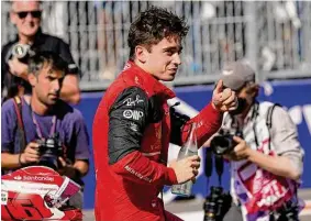  ?? Darron Cummings / Associated Press ?? Ferrari driver Charles Leclerc of Monaco gives a thumbs up after winning the pole during qualifying Saturday for the Formula One Miami Grand Prix.