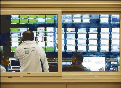  ??  ?? Technician­s work at the control booth at the Philippine Internatio­nal Convention Center in Pasay City on Friday.