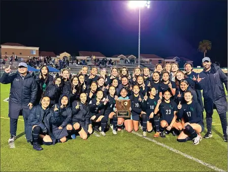  ?? PHOTO COURTESY OF GRANADA HILLS CHARTER ?? Granada Hills’ girls soccer team poses with the championsh­ip plaque after beating Apple Valley in the CIF SoCal Division III regional title game March 2.