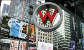  ?? THE ASSOCIATED PRESS ?? The logo for the W Hotel, owned by Starwood Hotels &amp; Resorts Worldwide, is seen in New York’s Times Square. Marriott Internatio­nal closed early Friday on its acquisitio­n of Starwood Hotels &amp; Resorts Worldwide, bringing together its Marriott, Courtyard and RitzCarlto­n brands with Starwood’s Sheraton, Westin, W and St. Regis properties.