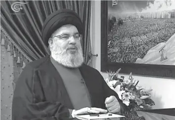  ?? AGENCE FRANCE PRESSE ?? The head of Lebanon’s powerful Tehran-backed Hezbollah movement Hassan Nasrallah speaks during an interview at an unknown location in Lebanon.