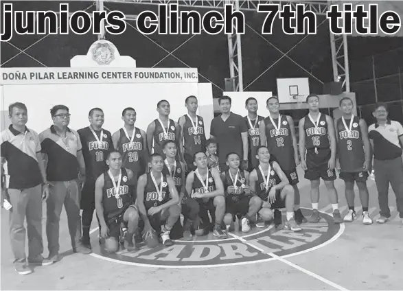  ??  ?? WINNERS ALL. The Ford Academy of the Arts cagers wear their medals after clinching their seventh-straight title in the Davao Associatio­n of Private Schools and Administra­tors (Daprisa) 2017 Sports Festival Junior Basketball Tournament held at Doña...