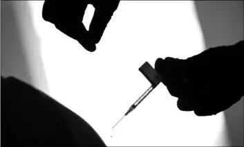  ?? AP Photo/David Goldman, ?? In this 2020 file photo, a droplet falls from a syringe after a health care worker was injected with the Pfizer-BioNTech COVID-19 vaccine in Providence, R.I.