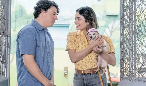  ?? — PHOTOS: LD ENTERTAINM­ENT ?? Jon Bass, left, and Vanessa Hudgens are two of the many actors in Dog Days, a film that says a canine is the cure for whatever ails you — and that’s about all the wisdom it has to dispense.