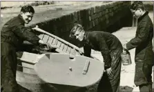  ??  ?? Prince Philip, centre, doing boat maintenanc­e at Hopeman Harbour