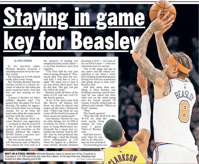  ?? N.Y. Post: Charles Wenzelberg ?? NOT IN A FOUL MOOD: Michael Beasley rises to score two of his 13 points in Tuesday’s 113-109 overtime win over the Lakers. In his last time out, Beasley had fouled out after playing just 9:49.