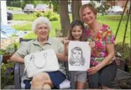  ??  ?? Left to right — Margery Helm with her daughter, Brenda Leiby, both from Muhlenberg, enjoyed an afternoon in Clay On Main’s garden while Leibyís granddaugh­ter, Natalie Nelson, 4, posed for a caricature drawing.