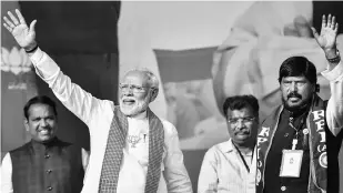  ?? PHOTO: PTI ?? PM Narendra Modi with RPI leader Ramdas Athawale during an election rally at Kharghar in Navi Mumbai on Wednesday. Modi slammed Opposition leaders seeking a link between the abrogation of Article 370 and the Maharashtr­a polls, and told them to go drown ( doob maro) for their stance. He also described himself and CM Devendra Fadnavis as the “double engine” of developmen­t and sought a second term for the leader