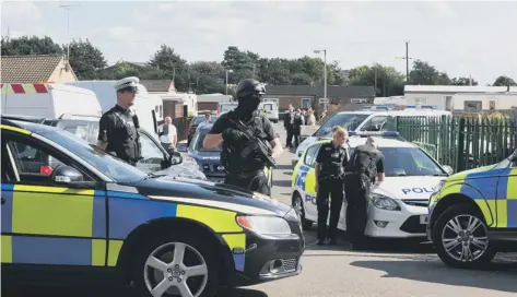  ??  ?? Armed police at the travellers’ site following the shootings last September.