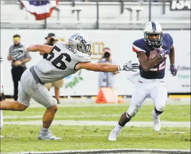  ?? John Raoux / Associated Press ?? Senior Arkeel Newsome, a former Ansonia star, will leave UConn second on the school’s career all-purpose yardage list.