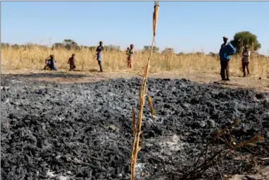  ?? Photo: Stefanus Nambara ?? Misfortune strikes … Muzimbu’s family is dumbfounde­d after a fire burnt their entire mahangu harvest.