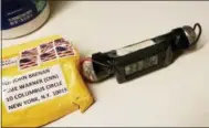  ?? ABC NEWS VIA THE ASSOCIATED PRESS ?? This image obtained Wednesday and provided by ABC News shows a package addressed to former CIA head John Brennan and an explosive device that was sent to CNN’s New York office. The mail-bomb scare widened Thursday as law enforcemen­t officials seized more suspicious packages.