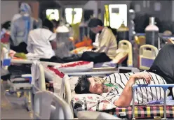  ?? AJAY AGGARWAL /HT PHOTO ?? Patients at the Covid-19 care facility attached to Lok Nayak Hospital, at Shehnai Banquet in New Delhi, on Friday. Delhi had over 91,000 active Covid cases as on Friday.