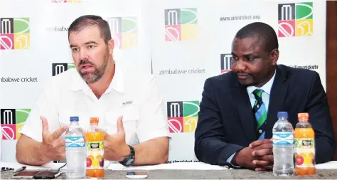  ??  ?? WHEN WE WERE FRIENDS . . . Zimbabwe Cricket chairman Tavengwa Mukuhlani (right) listens as the then national team coach Heath Streak addresses the media when the duo was still on good terms before the fallout triggered by the country’s failure to...