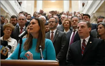  ?? (Arkansas Democrat-Gazette/Stephen Swofford) ?? Gov. Sarah Huckabee Sanders, surrounded by legislator­s, students, parents and teachers, announced details of her education plan on the steps outside the House Chambers in the State Capitol on Feb. 8, 2023.