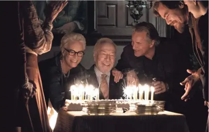  ?? PHOTOS BY CLAIRE FOLGER ?? Wealthy mystery writer Harlan Thrombey (Christophe­r Plummer, center) celebrates his birthday with family members (Jamie Lee Curtis, Don Johnson and Michael Shannon) before turning up dead in “Knives Out.”