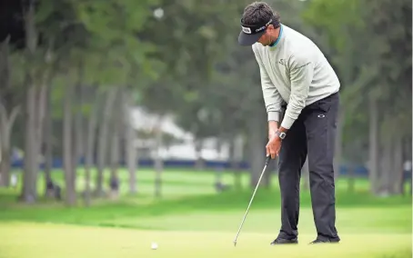  ?? DANIELLE PARHIZKARA­N/USA TODAY SPORTS ?? Bubba Watson putts on the fifth green during the second round of the U.S. Open golf tournament at Winged Foot Golf Club - West on Friday.