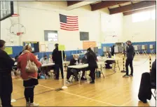  ?? Hearst Connecticu­t Media file photo ?? Voters gather in Weston Middle School’s gym to vote on Election Day 2020.