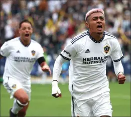  ?? PHOTO BY RAUL ROMERO JR. ?? Galaxy defender Julian Araujo, right, reacts after scoring the winning goal against the Nashville SC during the second half of Saturday's MLS first-round playoff match.